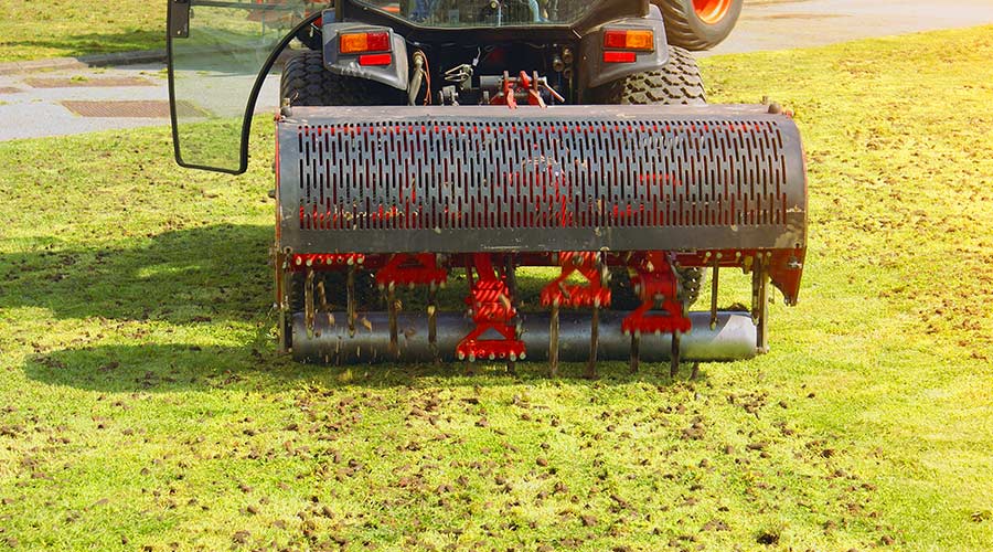 machine-being-used-to-aerate-grass-monroe-nc