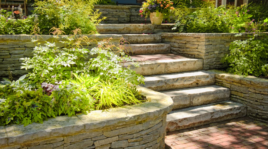 stone stairs outside of a house on a garden