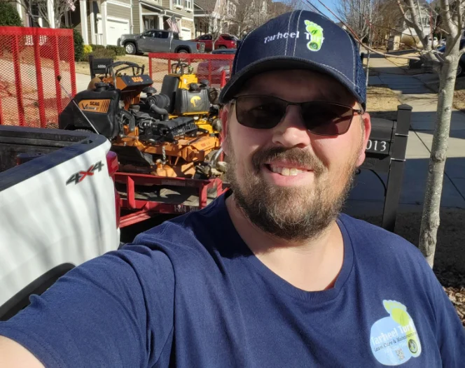 man wearing tarheel turf uniform ready to serve you monroe nc